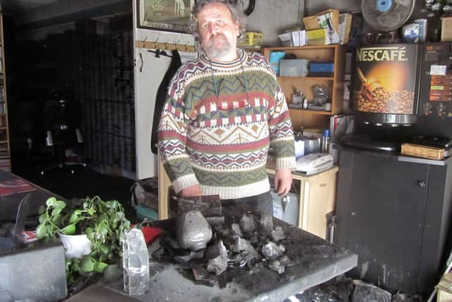 Tony Smith, station manager at Angel Radio in Havant, standing in the charred remains on the studio following a huge fire in 2015. They quickly rebuilt and saved 150,000 records