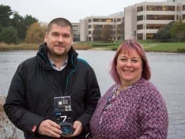 Darrel Wright, photo competition winner, with Karen Tyrrell, head of marketing and client services at Lakeside North Harbour