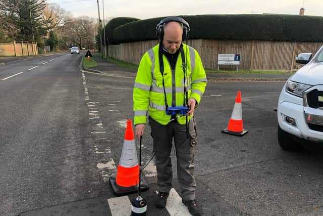 Here Mr Mackenzie is using a ground microphone to listen for the leak