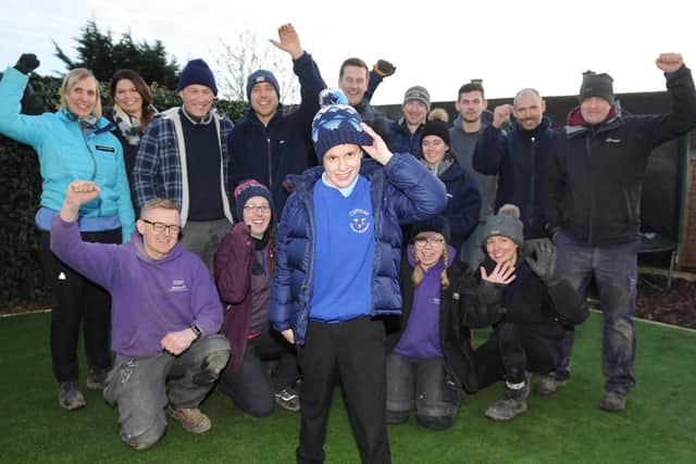 Rudy Canavan 10 with the Wellchild and Siemens team in his new garden. Picture: Habibur Rahman.