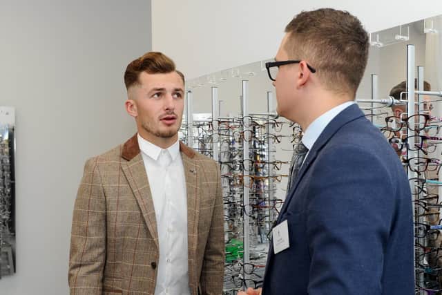 Brandon Coleman, left, talks to Daniel Stride, clinic manager at the University of Portsmouth's new research optometry clinic Picture: Sarah Standing