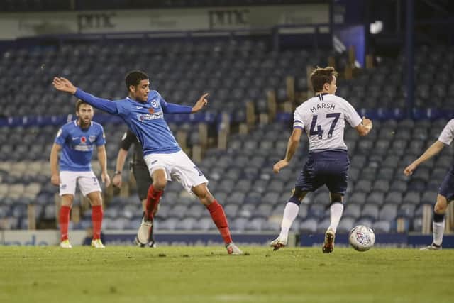 Louis Dennis pictured in a Checkatrade Trophy tie this season in front of a swathe of empty seats at Fratton Park