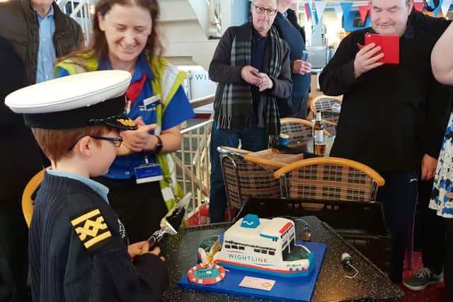 Ellis cuts the cake