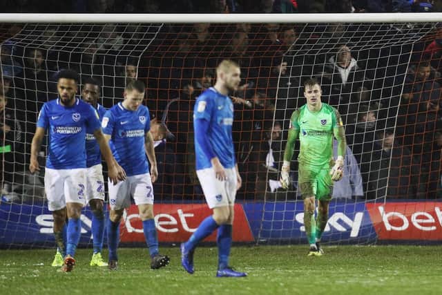 Pompey dejected after conceding against Luton. Picture: Joe Pepler