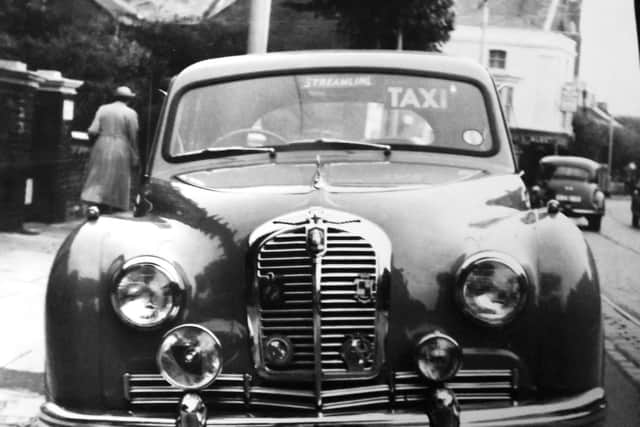 Seen standing in Victoria Road South, Southsea, is a taxi used by Streamline drivers in the mid 1950s. To the rear is the Nelson Hotel.