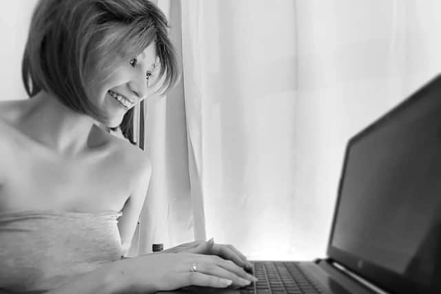 Jasmine writing her blog whilst in hospital