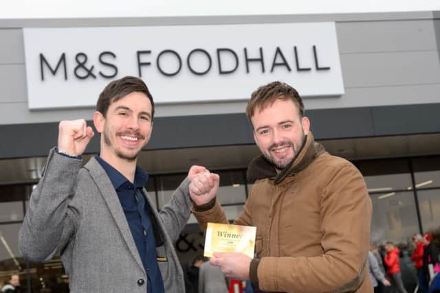 Store manager Alex Pattison with 200 voucher winner Scott Furber, from Gosport, at the opening of the M&S Foodhall at Brockhurst Gate Retail Park in Gosport