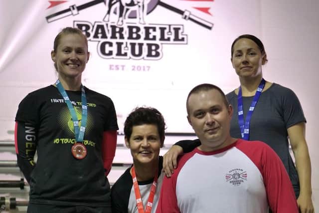 Lou Herron, Jo MacManus and Karen Hawen with Fareham Barbell Club head coach Przemek Borak
