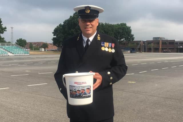 Chief petty officer at HMS Collingwood, Andy Gibbs, who has helped to raise more than 40,000 for the Royal Navy and Royal Marines Charity. Here he is with one of the buckets he uses to carry out collections for the cause across the country