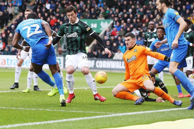 Omar Bogle during a goalmouth scramble. picture: Joe Pepler