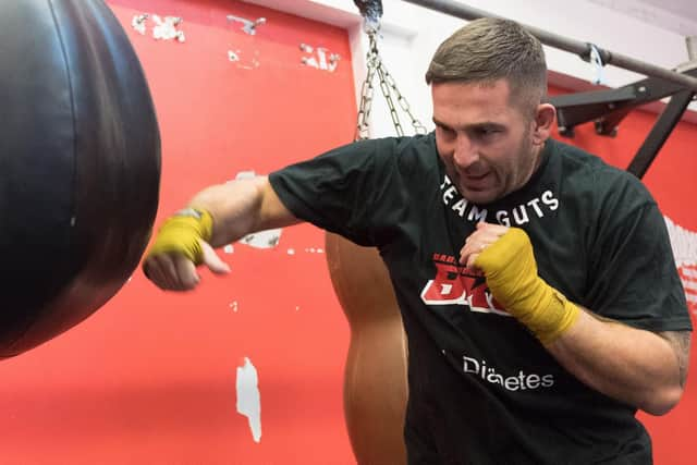 Mickey Parker works out on a punchbag. Picture: Keith Woodland