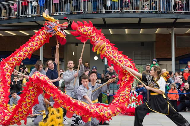 Performers from UK Shaolin Temple wow crowds at Gunwharf Quays with a dragon dance as the centre hosts its annual Chinese New Year celebrations - this year celebrating the year of the pig. Picture: Duncan Shepherd