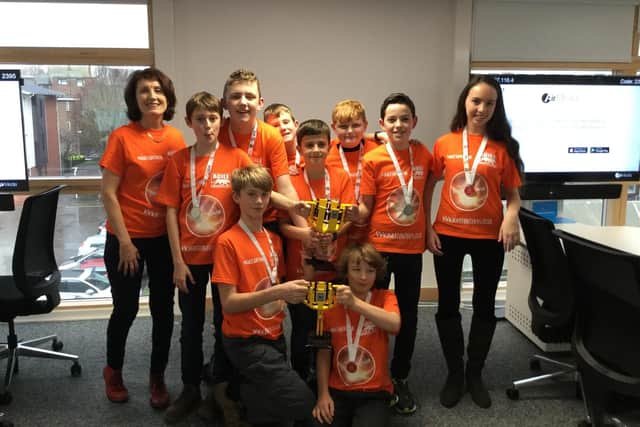 Liz Stoneham's Agile Supernova team with their trophies after winning the First Lego League regional heat at the University of Portsmouth in December. Picture: Liz Stoneham