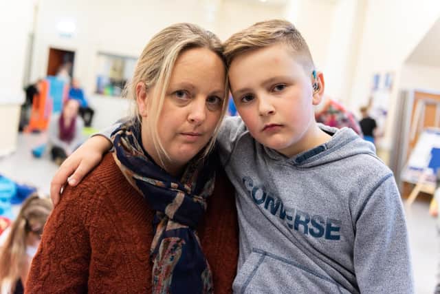 Emma Heaysman with her son Lewis, who she fears could suffer at school if Hampshire councillors approve 700,000 savings to its Specialist Teacher Advisory Service. Picture: Duncan Shepherd