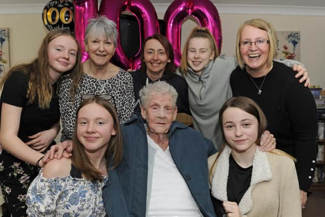Dorothy Aslett celebrates her 100th birthday with her family at Hale Court in Fratton. 
From left to right: great-grandaughter Amy Lloyd, daughter in law Wendy Aslett, granddaughter Kim Aslett, great granddaughter Ashleigh Aslett, granddaughter Sam Loyd, with front (left), great granddaughters Erin Lloyd, and Taylor Nicholson. 
Picture: Ian Hargreaves  (030219-5)