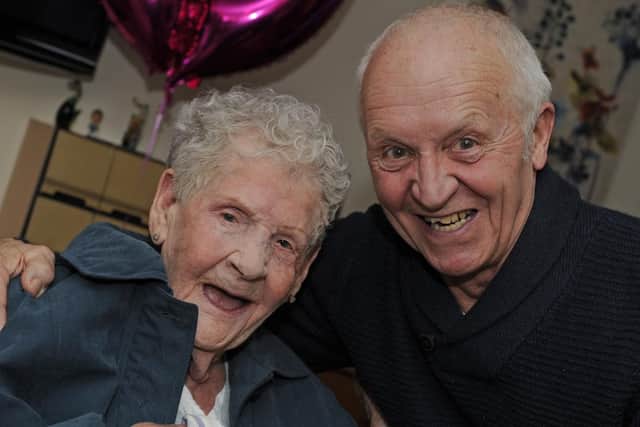 Dorothy Aslett celebrates her 100th birthday with her family at Hale Court in Fratton with her nephew Mike Culley.
Picture: Ian Hargreaves  (030219-6)