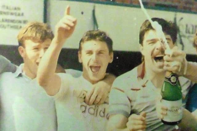 Mick Kennedy, centre, celebrates with Kevin Ball, left, and Mick Quinn
