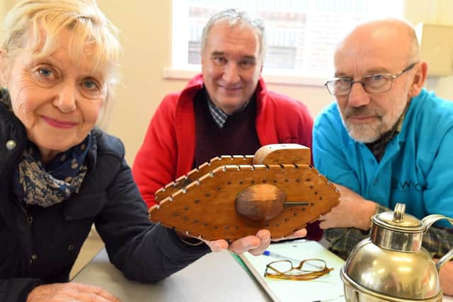 'Trench Art' - a First World War tank likely to have been made in about 1916
From left, Shirley Churcher with her beloved memento, with Ian Whitlock and Jim Clipson 
Picture: Malcolm Wells (190213-8039)