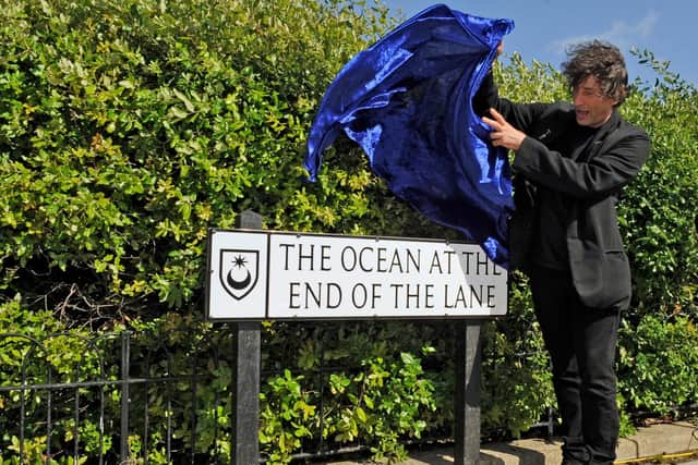 World-famous author Neil Gaiman opening The Ocean at the End of the Lane, a Southsea road, near Canoe Lake, named after one of his books in 2013. Picture: Malcolm Wells (132290-7653)
