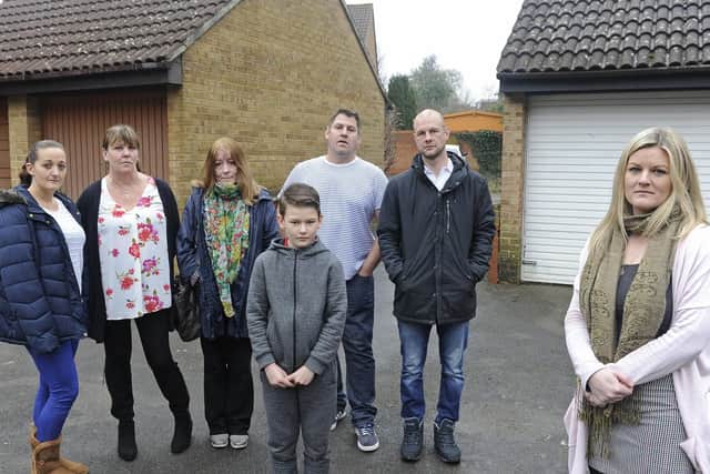 A group of Fareham residents are angry following a burst sewage main pipe which has flooded their garages in Dryden Close. (l to r),  Rebecca Scott, Paulette Jenner, Elizabeth Rigby, Steve Jenner, Mark Gibbs and his son Jack Gibbs (11), with front, spokesperson for the group,  Kristieanne Gibbs.
Picture: Ian Hargreaves  (160219-1)
