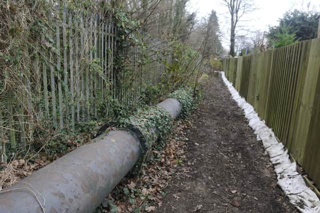 A group of Fareham residents are angry following a burst sewage main pipe which has flooded their garages and gardens in Dryden Close. The pipe flows behind Rebecca Scott's garden.

Picture: Ian Hargreaves  (160219-3)