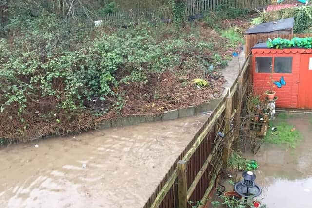 Gardens left flooded after a manhole cover burst.