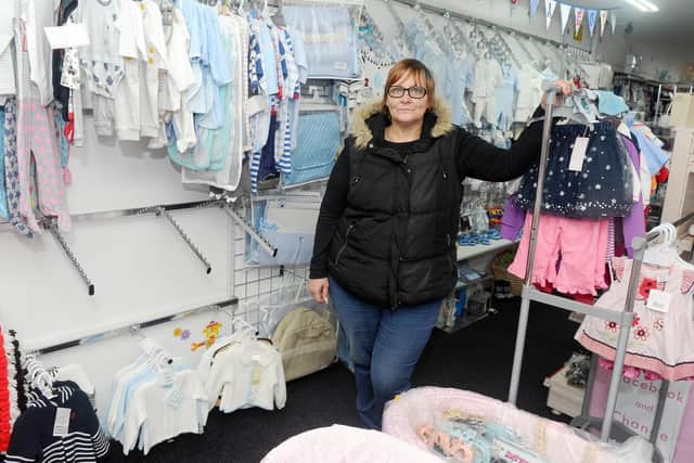 Owner of Funky Baby Boutique Fiona Bennett-Rice, next to the empty rails where stock was stolen from.
Picture: Sarah Standing (180219-9477)