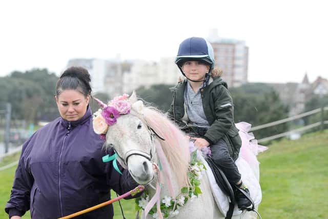 Princess the Unicorn was offering rides at Southsea Model Village for children during half term. Pictured is: Cody Davis (seven) of Fratton, with Clare Ward.
Picture: Sarah Standing (180219-1380)