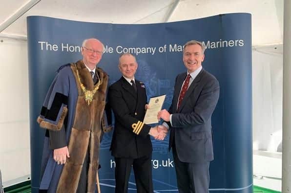 Commander Philip Harper (centre) receiving his Chartered Master Mariner status from Second Sea Lord Vice-Admiral Tony Radakin (right) and Master Mariner Captain Robert Booth (left). Picture: Royal Navy