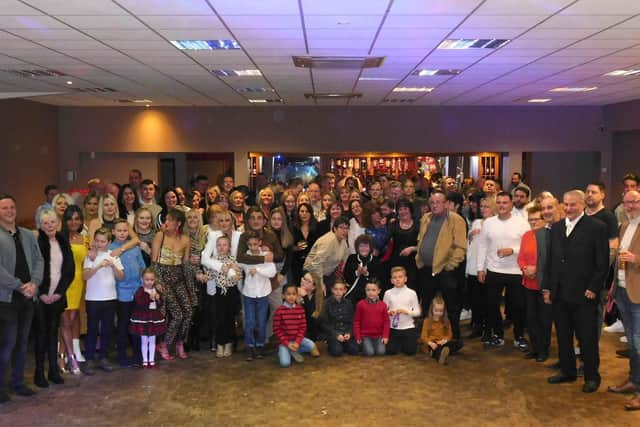 The huge family photo with just some of Norma Pharoahs children, grandchildren and great-grandchildren.