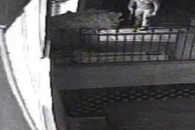 Operation Prometheus. CCTV footage of the burglar getting ready to enter a house with a sawn-off-shotgun. Supplied by Surrey Police. PPP-180130-120306001