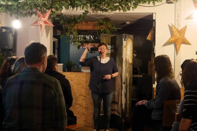 Sam Cox comperes The Front Room's spoken word evening at Hunter Gatherer coffee shop in Southsea on February 7, 2019. Picture by Alistair Winter