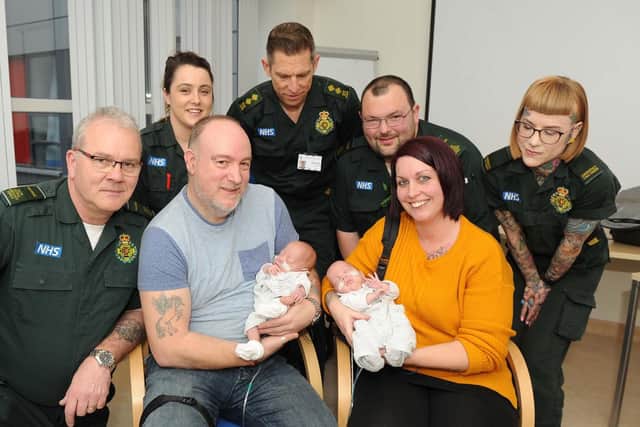All the paramedic team that helped on the day, Ray Connearn, Deneka O'Brien, Gilbert Hall, James Grant and Kellie Blake with the twin's parents, Mark Lawrence and Nikki Fletcher with the twins, Oliver and George
Picture: Habibur Rahman
.