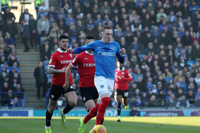 Ronan Curtis being chased down by the Barnsley defence
