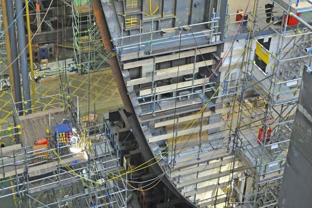 Parts of the HMS Queen Elizabeth in construction with Portsmouth Naval Base in December 2010. Picture: Sarah Standing (104168-1047)