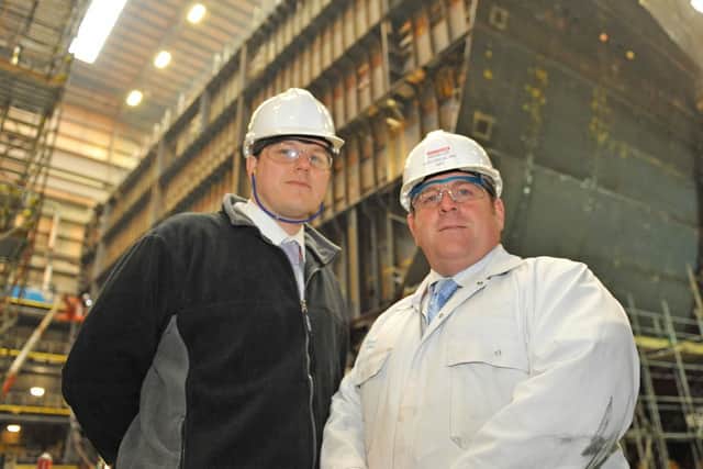 Nick East, mechanical manager and Kevin Lee, electrical manager, infront of parts of the HMS Queen Elizabeth in construction with Portsmouth Naval Base in 2010. Picture: Sarah Standing (104168-1126)