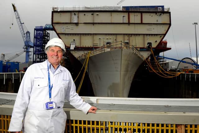 Tom Gifford at the front HMS Queen Elizabeth in December 2012 - when the future Royal Navy flagship was starting to take shape. Picture: Allan Hutchings (123920-409)