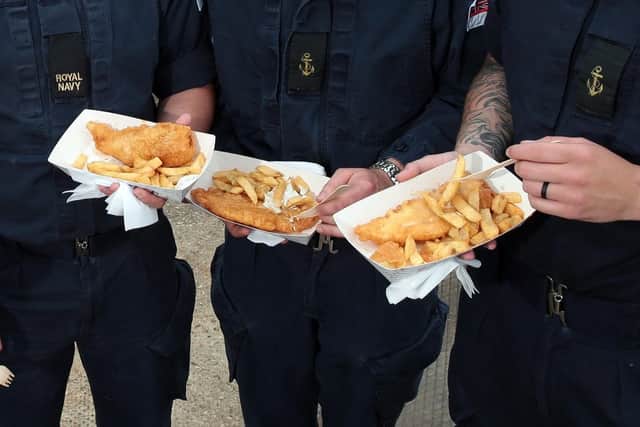 A Tory peer has suggested escape hatches on submarines should be made bigger to accommodate obese submariners. Pictured are sailors eating fish and chips.
Picture: Chris Moorhouse
