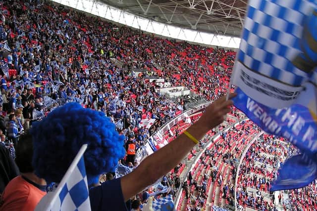 Pompey fans waving flags at Wembley during 2008 FA Cup final.
