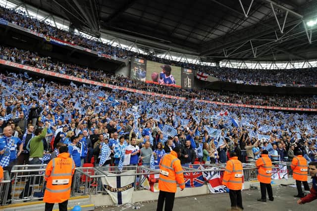 Pompey fans cheer on the Blues during the 2008 FA Cup Final at Wembley Stadium.