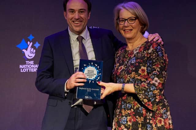 The News' chief sports writer Neil Allen receiving his award