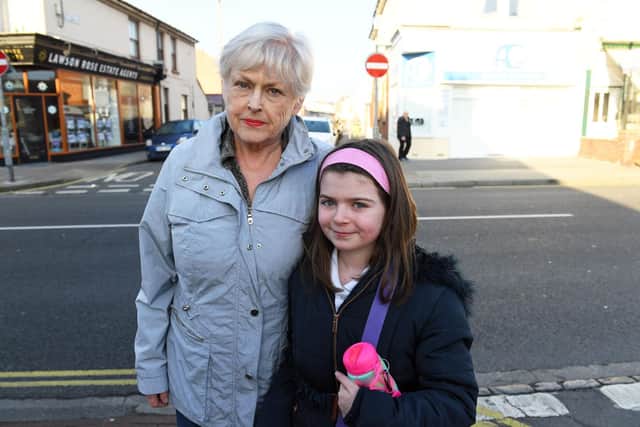Janet Clift with her granddaughter Lily Daggon, having just crossed the busy stretch of road. 
Picture: Malcolm Wells (190227-4370)