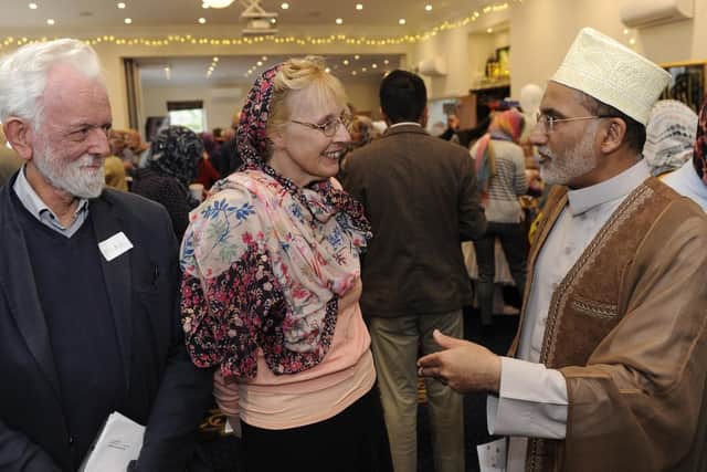 An open day has been held at the Al Mahdi Centre in Funtley to show what goes on inside Mosques. Imam Sheikh Fazle Abbas Datoo chats to Mike Smith and Estelle Rombough.Picture: Ian Hargreaves  (020319-1)