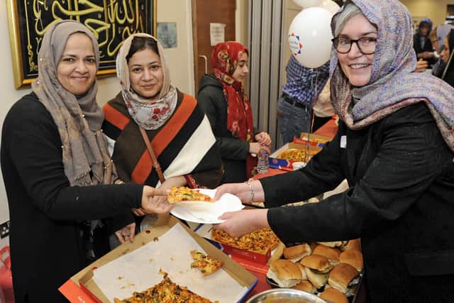 Shamin Vakil, Hina Hyder serve food to Catherine Harper at the Al Mahdi Centre, in Titchfield.
Picture: Ian Hargreaves  (020319-3)