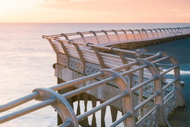 Winding ornate rails stretch out at South Parade Pier at Southsea.