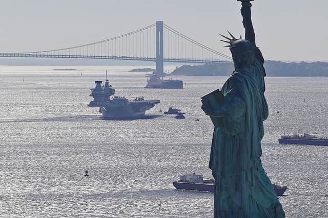 The Statue of Liberty cast a watchful eye on HMS Queen Elizabeth as she arrived in the Big Apple