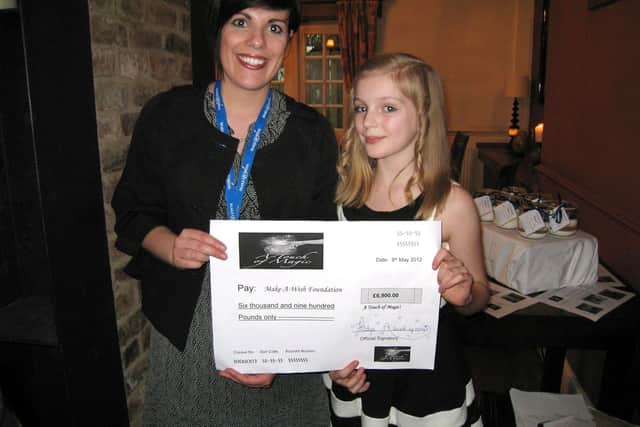 A cheque presentation by Jess Ridge to Sarah Shearman from the Make a Wish foundation in 2012
Picture: Jacky Keyes
