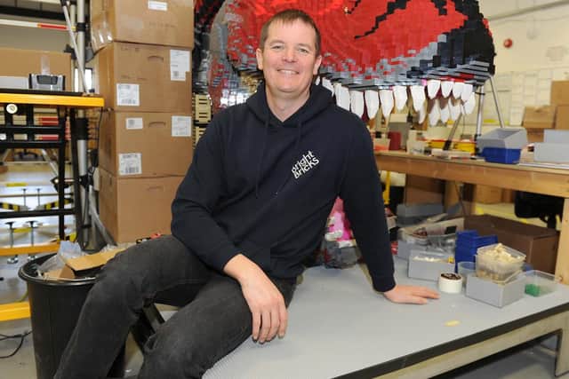 Bright Bricks creative director, Ed Diment, from Waterlooville, with the T-Rex. Picture: Habibur Rahman