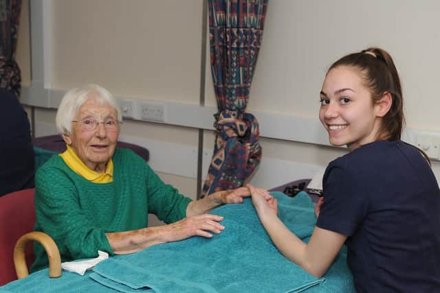 Margaret Fry, 98, gets her nails done by Havant and South Downs College pupil Kasey Cripps, 17. Picture: Habibur Rahman