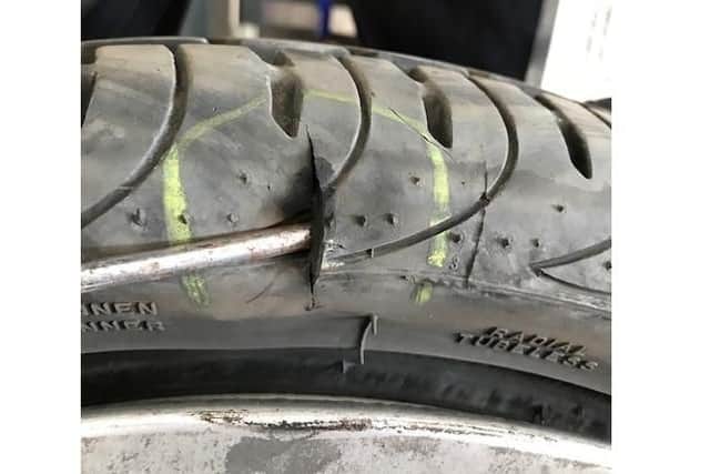 The damage to Tony Storey's tyre after he drove over one of the raised ironworks on Sunday